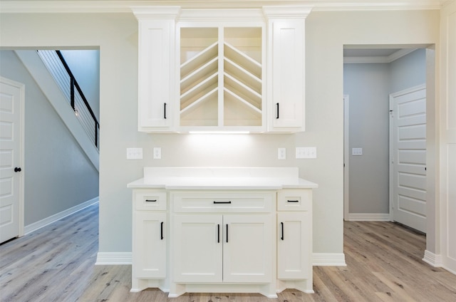 14835 Fallow Ln, Tyler, TX 75706 - bar with baseboards, stairs, and light wood-type flooring