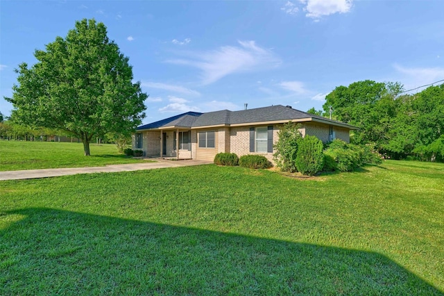 ranch-style home featuring a front yard