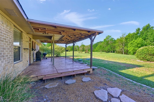 view of yard featuring a wooden deck and visible vents