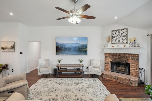 living room with a brick fireplace, wood finished floors, baseboards, ceiling fan, and recessed lighting