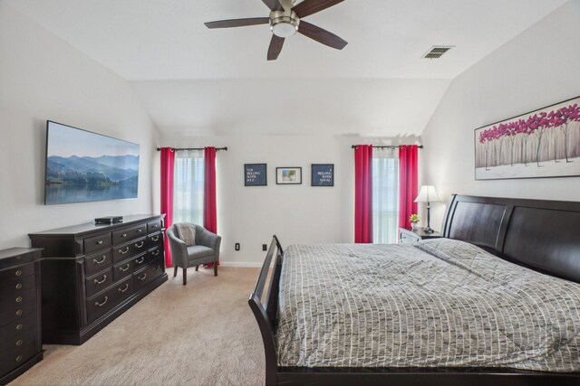 bedroom featuring visible vents, ceiling fan, light colored carpet, and lofted ceiling