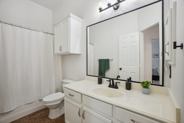 full bathroom featuring vanity, shower / bath combo, and toilet