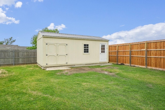 view of outbuilding with an outdoor structure and a fenced backyard