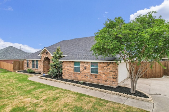 single story home featuring fence, a shingled roof, a garage, and brick siding