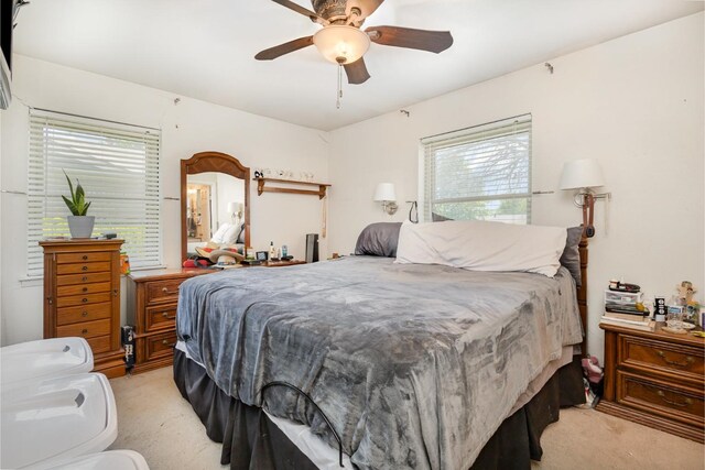 kitchen featuring white cabinets, a ceiling fan, butcher block counters, and visible vents