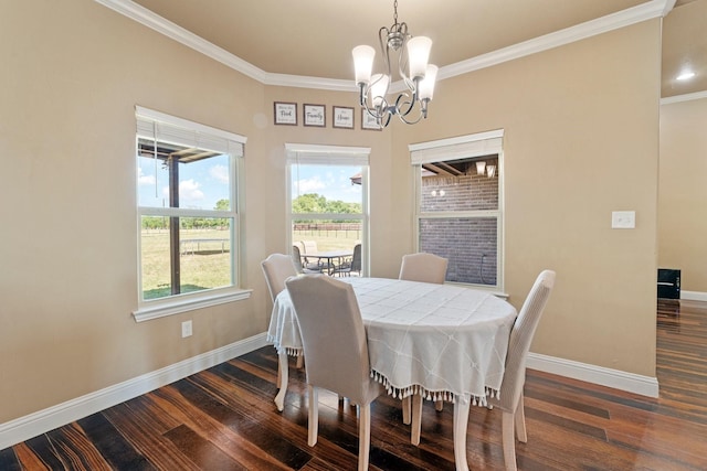 dining space with dark wood-type flooring, baseboards, a chandelier, and crown molding