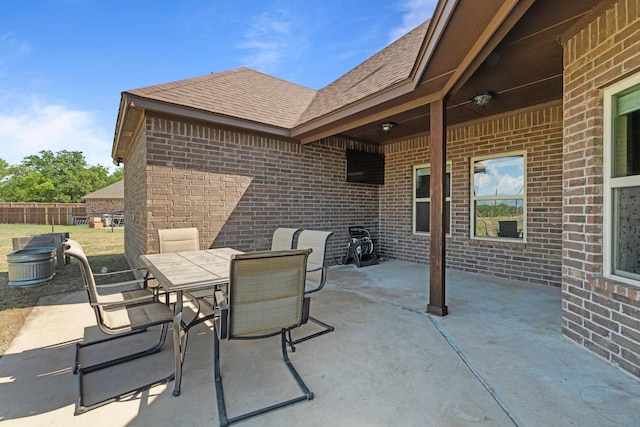 view of patio / terrace featuring fence and outdoor dining area