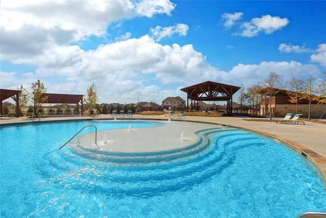 pool with a gazebo and a patio