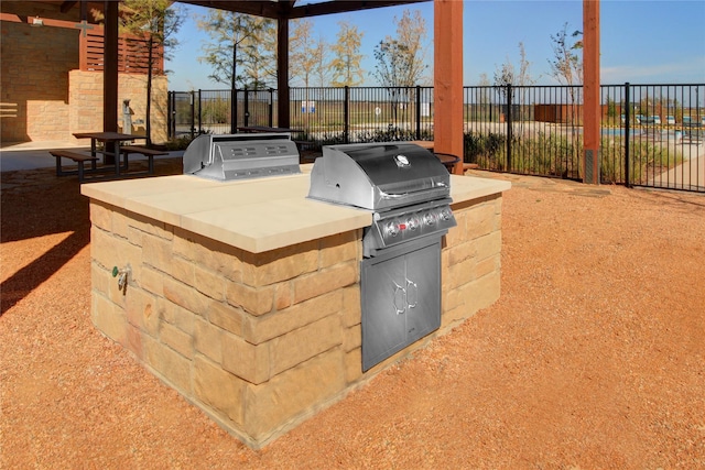 view of patio / terrace featuring grilling area, fence, and area for grilling