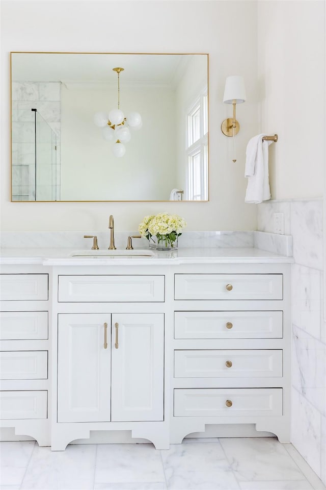 7206 Northaven Rd, Dallas, TX 75230 - full bath with a shower stall, vanity, a chandelier, marble finish floor, and ornamental molding