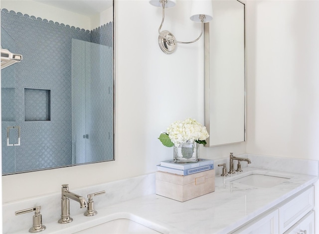 7206 Northaven Rd, Dallas, TX 75230 - bathroom with double vanity, a shower, and a sink