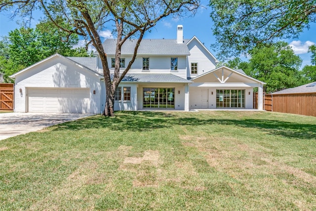 7206 Northaven Rd, Dallas, TX 75230 - back of property featuring driveway, a chimney, an attached garage, and fence