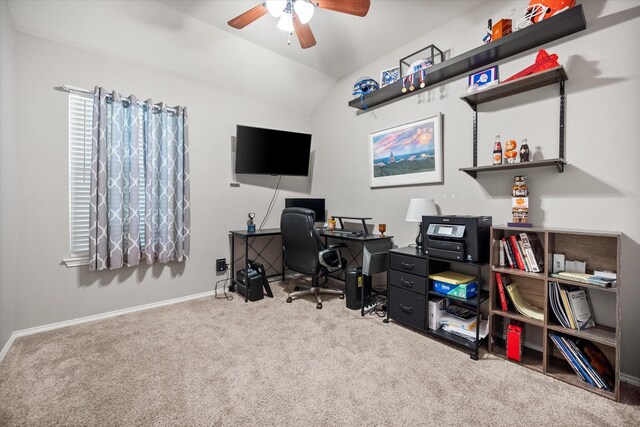 carpeted office featuring lofted ceiling, baseboards, and ceiling fan