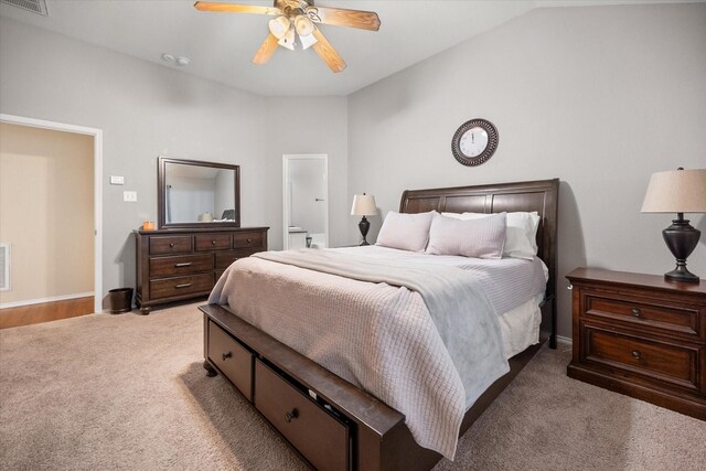 bedroom with vaulted ceiling, a ceiling fan, carpet flooring, and visible vents