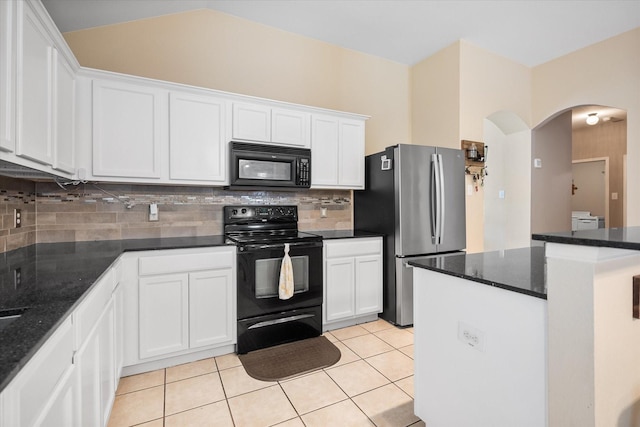 kitchen with black appliances, arched walkways, tasteful backsplash, and white cabinetry