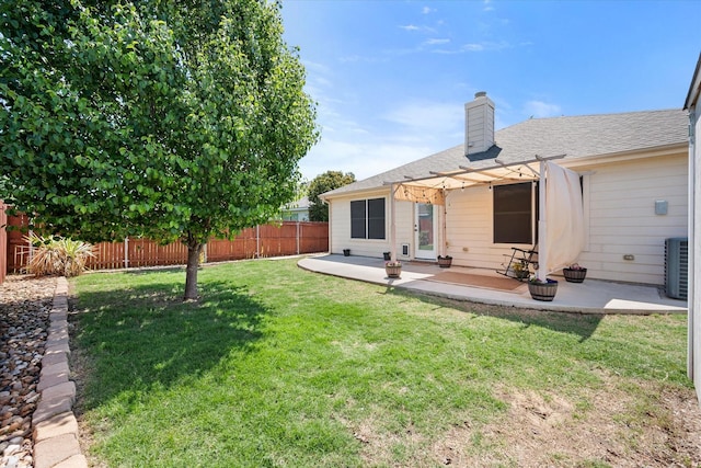 view of yard with a pergola, a patio area, central AC, and a fenced backyard
