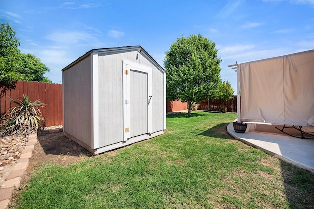 view of shed featuring a fenced backyard