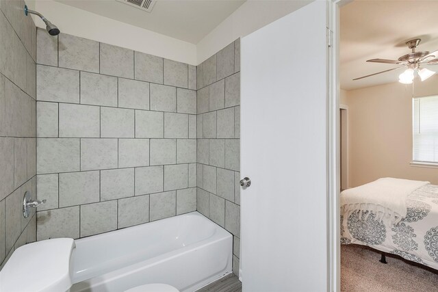 bathroom featuring shower / washtub combination, ensuite bathroom, and ceiling fan