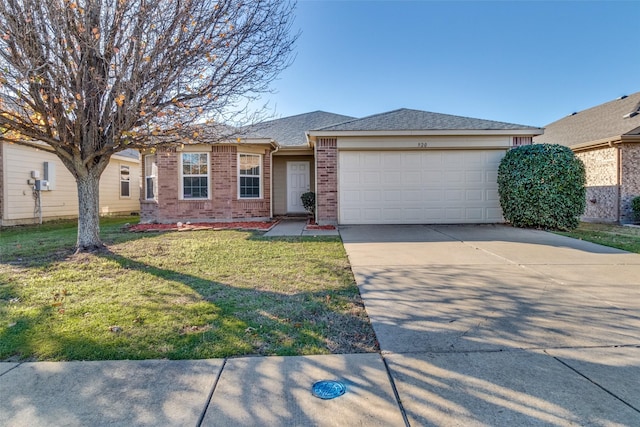 ranch-style house featuring roof with shingles, a front lawn, driveway, brick siding, and an attached garage