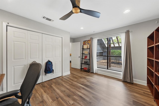 office space with baseboards, visible vents, recessed lighting, a ceiling fan, and wood finished floors