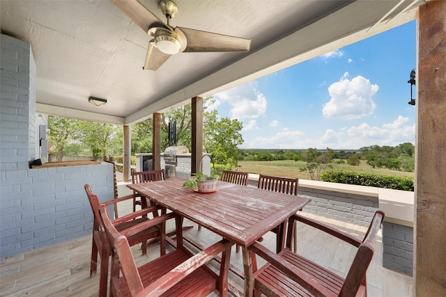 view of patio featuring outdoor dining space and ceiling fan