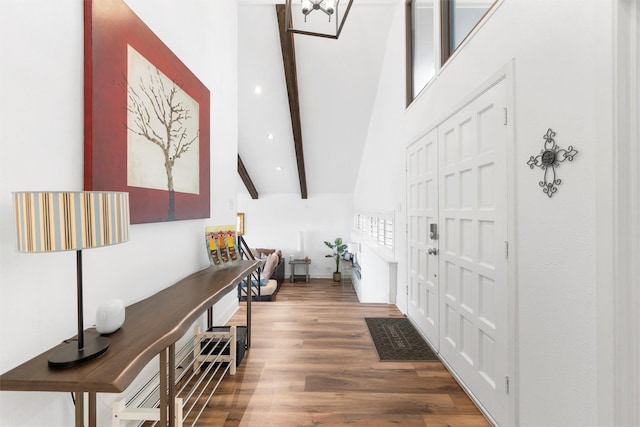 entryway featuring recessed lighting, an inviting chandelier, wood finished floors, beamed ceiling, and high vaulted ceiling