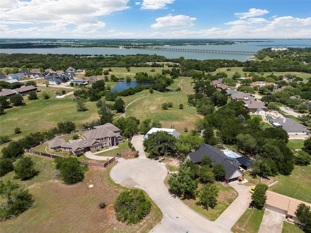 birds eye view of property with a residential view and a water view