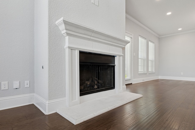 3213 Matisse Ln, Mckinney, TX 75070 - detailed view of ornamental molding, wood finished floors, a fireplace with raised hearth, a textured wall, and recessed lighting