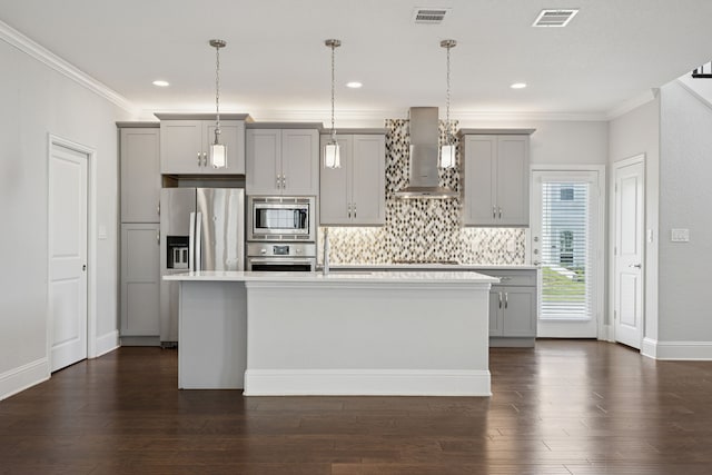 3213 Matisse Ln, Mckinney, TX 75070 - kitchen with gray cabinetry, stainless steel appliances, wall chimney range hood, light countertops, and crown molding