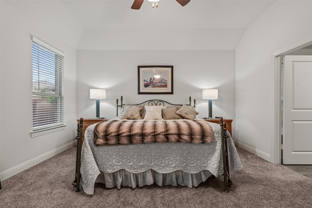 bedroom with ceiling fan, carpet floors, vaulted ceiling, and baseboards