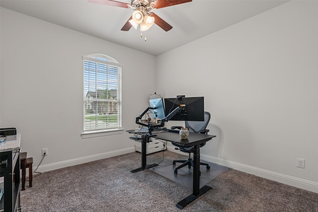 office space featuring carpet, a ceiling fan, and baseboards