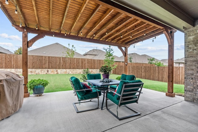 view of patio with a fenced backyard and outdoor dining space