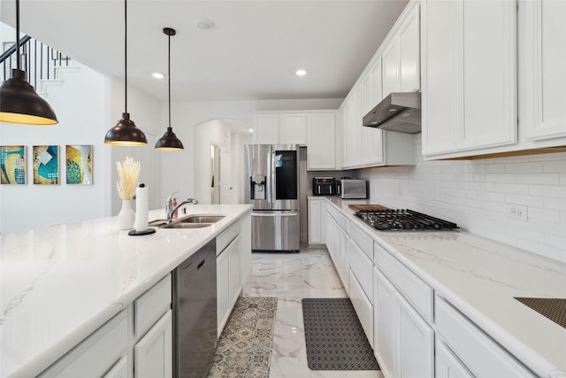 1313 Canuela Way, Justin, TX 76247 - kitchen featuring marble finish floor, range hood, stainless steel appliances, a sink, and white cabinetry