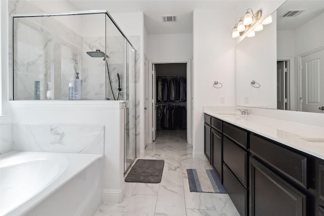 1313 Canuela Way, Justin, TX 76247 - bathroom with marble finish floor, a marble finish shower, a sink, and visible vents