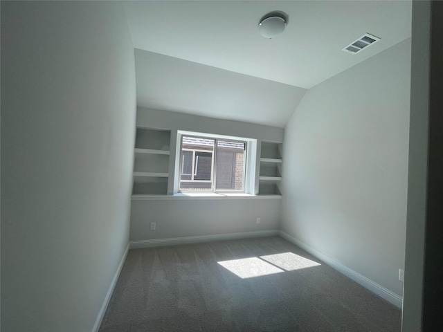 6109 Rodin Dr, Royse City, TX 75189 - empty room with lofted ceiling, visible vents, carpet flooring, and baseboards
