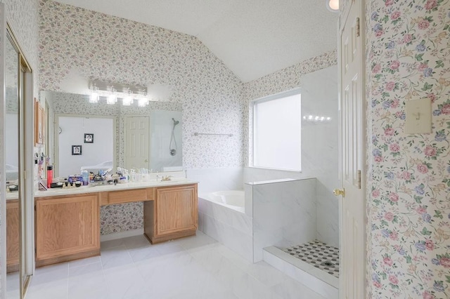 bathroom featuring vaulted ceiling, a garden tub, wallpapered walls, vanity, and a walk in shower