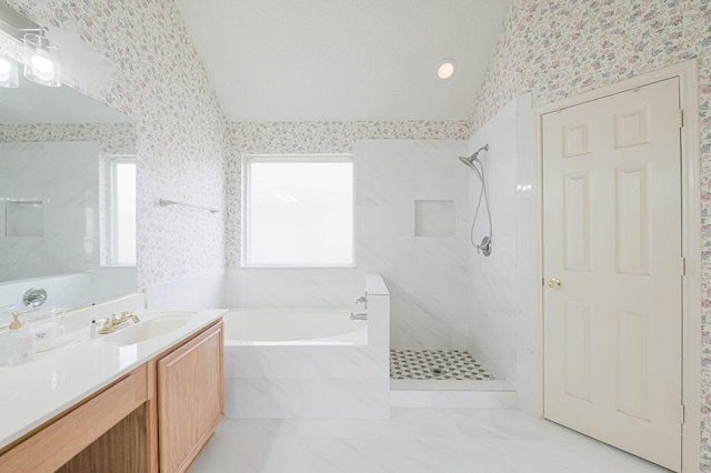 full bathroom featuring a bath, vaulted ceiling, and a walk in shower