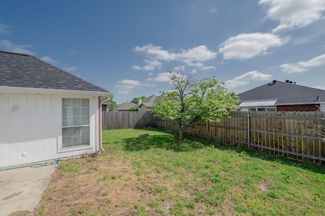 view of yard with a fenced backyard