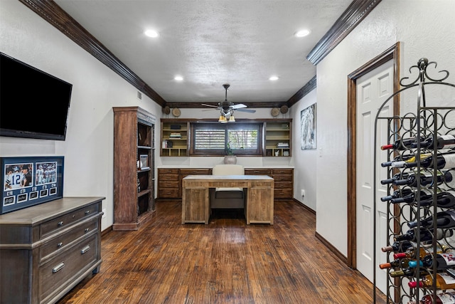 interior space with dark wood finished floors, a ceiling fan, baseboards, and ornamental molding