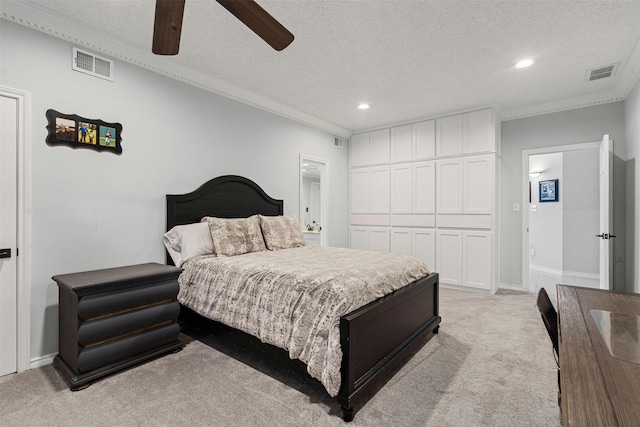 bedroom with visible vents, recessed lighting, light colored carpet, and crown molding