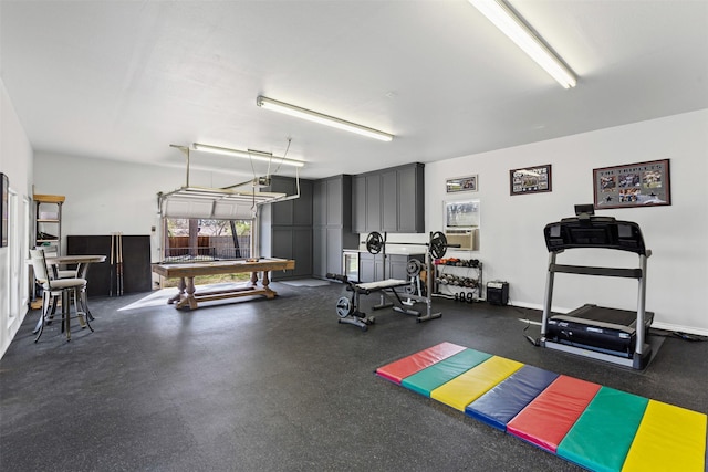 exercise room featuring pool table and a garage
