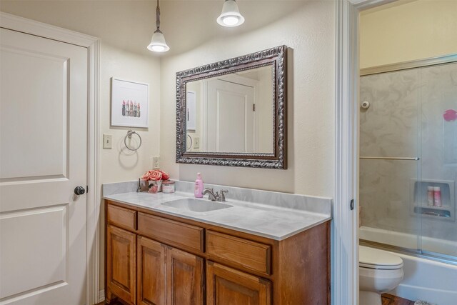 13043 W County Road 4182, Henderson, TX 75654 - full bathroom featuring shower / bath combination with glass door, toilet, and vanity