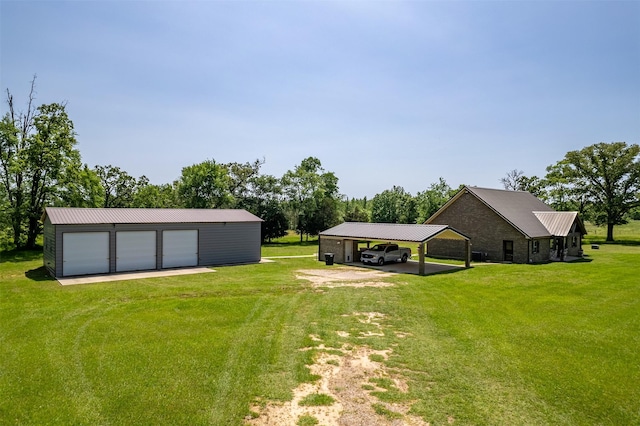 13043 W County Road 4182, Henderson, TX 75654 - view of yard featuring driveway, an outbuilding, and a detached garage