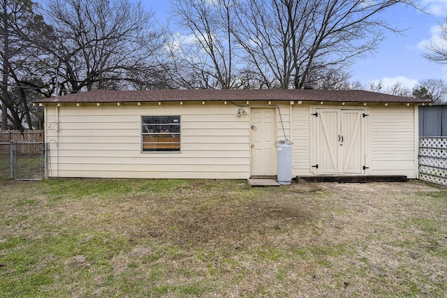 view of outbuilding with fence
