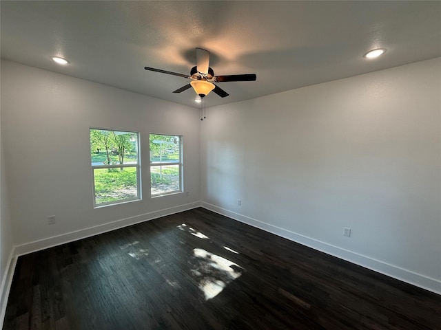unfurnished room featuring recessed lighting, a ceiling fan, baseboards, and dark wood-style flooring