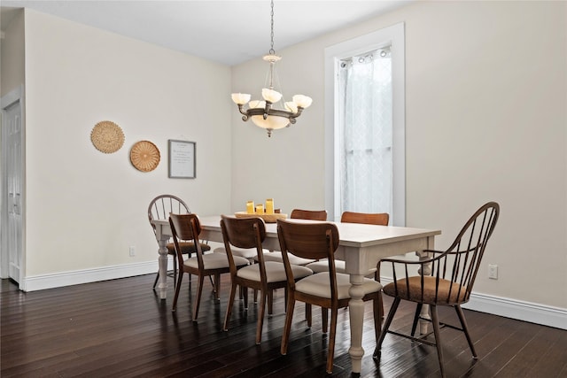 501 N Anglin St, Cleburne, TX 76031 - dining area with baseboards, a chandelier, and dark wood-style floors