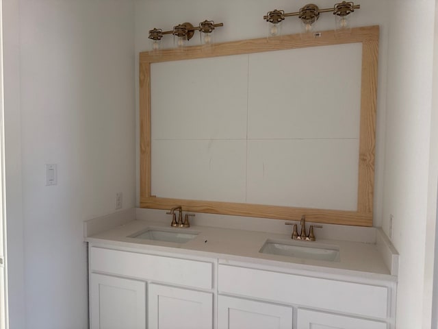 bathroom with a sink and double vanity