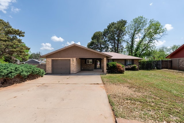 ranch-style house with a front lawn, an attached carport, driveway, fence, and brick siding