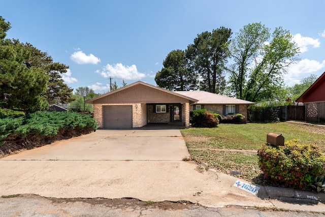 ranch-style house featuring fence, a front lawn, brick siding, and concrete driveway