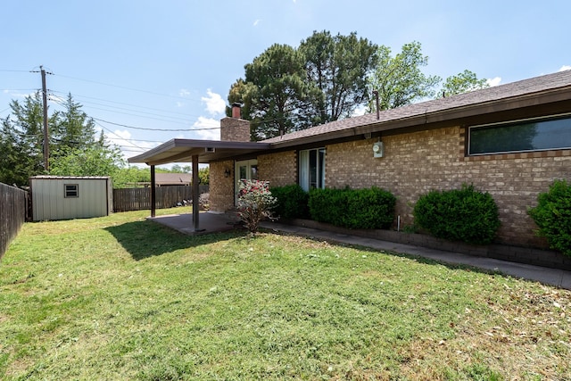 exterior space featuring an outdoor structure, a patio area, a fenced backyard, and a storage shed